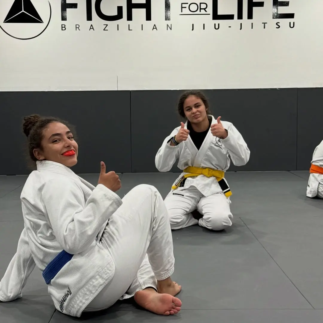 Women's Jiu-Jitsu class with their coach